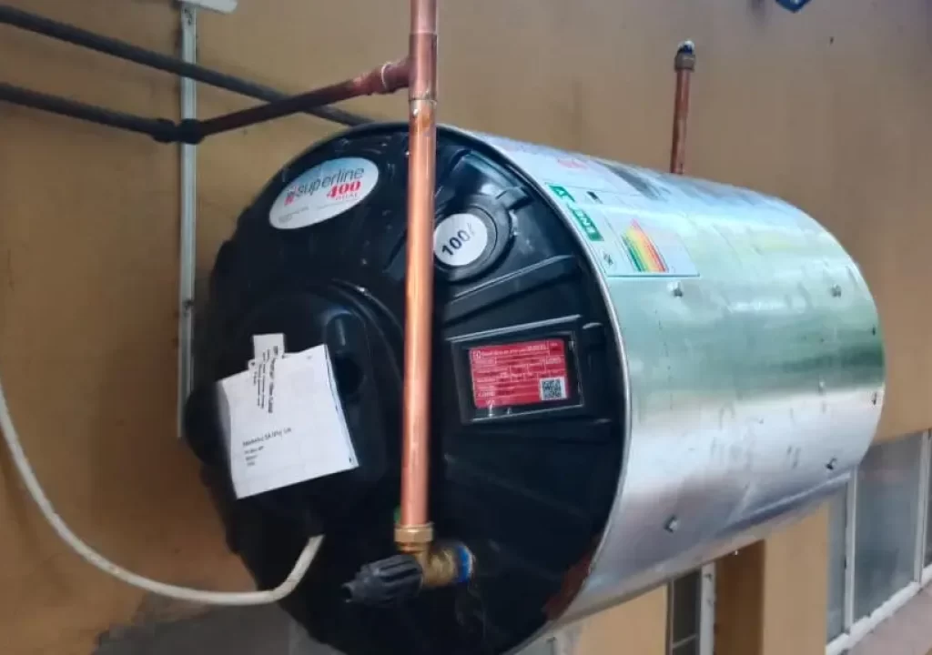 Unique Fix technician installing an electric geyser